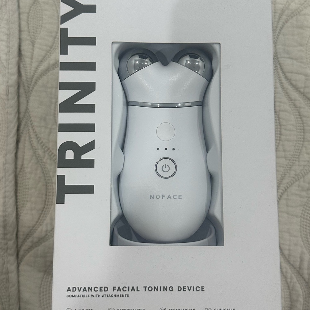 NuFace White Trinity Facial Toning Device 
In box, sealed. Never opened or used